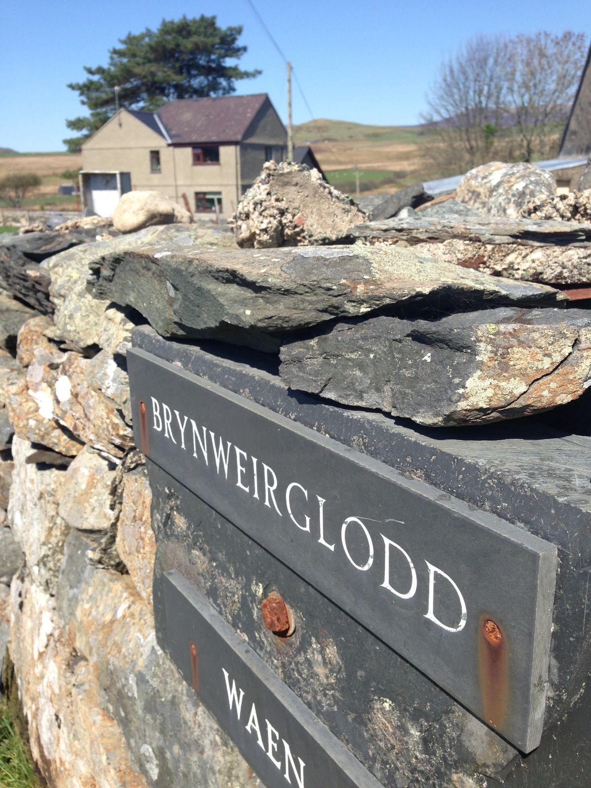 The Bryn-Weirglodd name sign set into the entrance wall