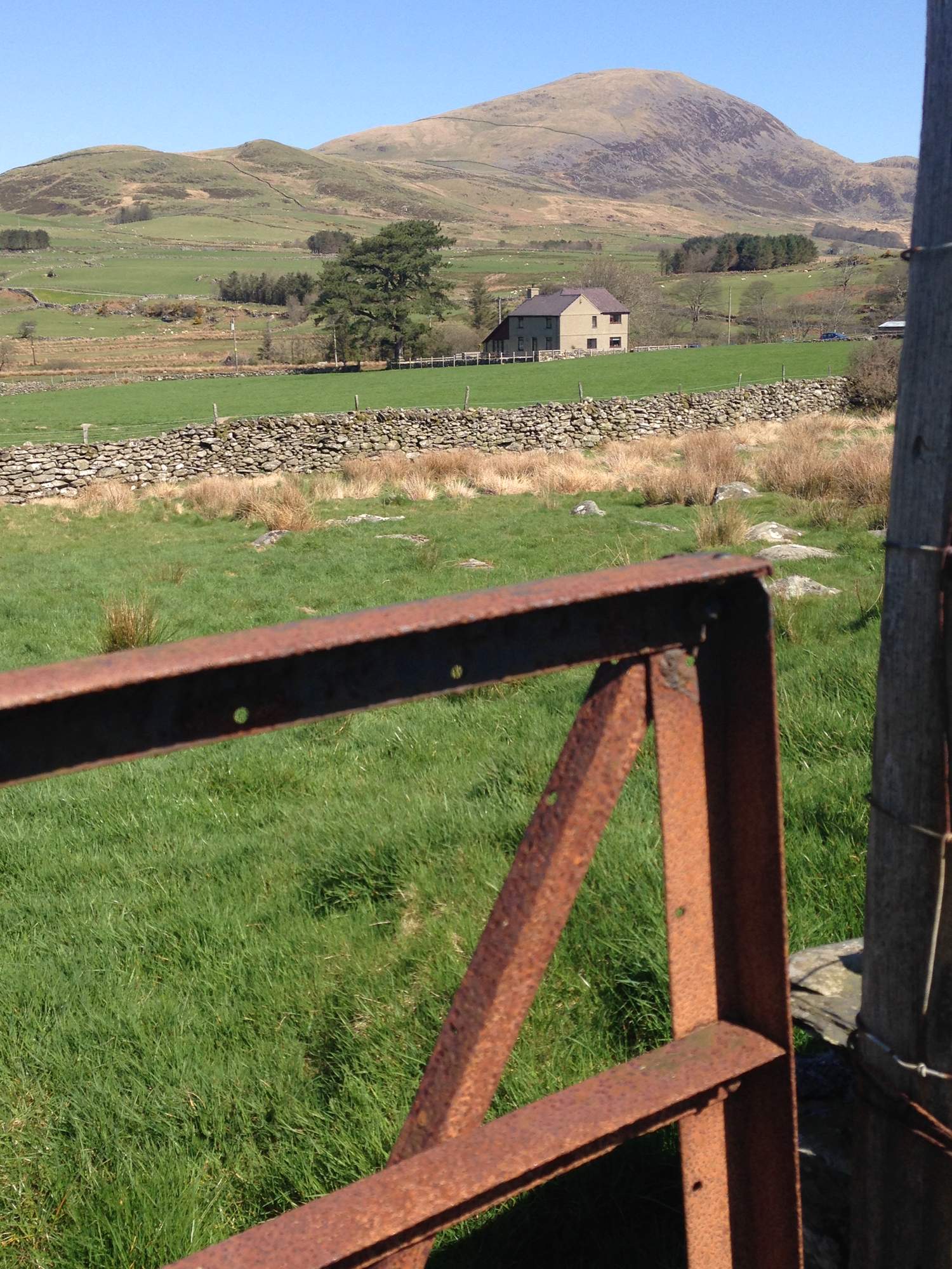 Bryn-Weirglodd farmhouse set in the green hills of the Cwmystradllyn valley